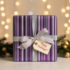 Luxury purple and silver striped holiday gift wrap with a silver ribbon and "Happy Holidays!" tag.