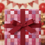 Red patchwork print luxury gift wrapping paper with a dark red satin bow, perfect for elegant Christmas or birthday presents.