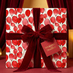 Elegant gift wrapped in red balloon birthday wrapping paper with velvet ribbon from Wrapped Studios.