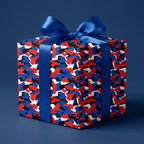 Red, white, and blue camo wrapping paper with a blue satin bow by Wrapped Studios.