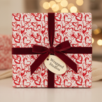 Red and white heart pattern wrapping paper with a burgundy velvet ribbon and bow, perfect for a romantic gift or Valentine's Day.