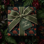 Elegant floral wrapping paper with red roses, tied with an olive green ribbon and “Forever and Always” tag.
