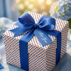 Red and blue polka dot wrapping paper with a royal blue ribbon and 'For You' tag, by Wrapped Studios.