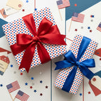 Patriotic 4th of July polka dot wrapping paper with red and blue satin bows by Wrapped Studios.