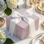 Patriotic red, white and blue polka dot wrapping paper with a white bow by Wrapped Studios.