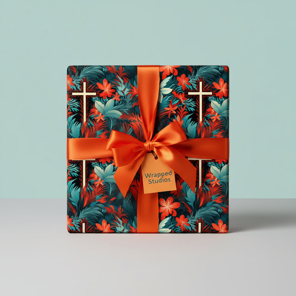 Square gift wrapped in floral wrapping paper with orange ribbon and bow on table.