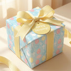 Pastel Easter wrapping paper with crosses, a yellow ribbon, and a Spring Blessings tag by Wrapped Studios.