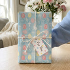 Christian Easter wrapping paper with pastel eggs and crosses by Wrapped Studios.