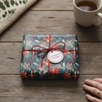 Gift wrapped in elegant floral wrapping paper with a red twine bow, perfect for birthdays or special occasions.