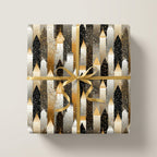 Elegant gift wrapped in black, white, and gold Art Deco style wrapping paper with a gold satin ribbon.