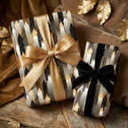 Elegant geometric wrapping paper with gold and black ribbons on gifts.