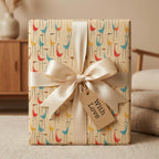 Mid-century modern bird wrapping paper with cream satin bow and gift tag by Wrapped Studios.