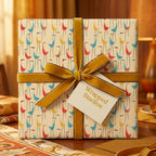 Retro mid-century modern bird wrapping paper with a yellow velvet ribbon, by Wrapped Studios.