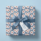 Vintage daisy floral wrapping paper with a dusty blue satin bow, by Wrapped Studios.