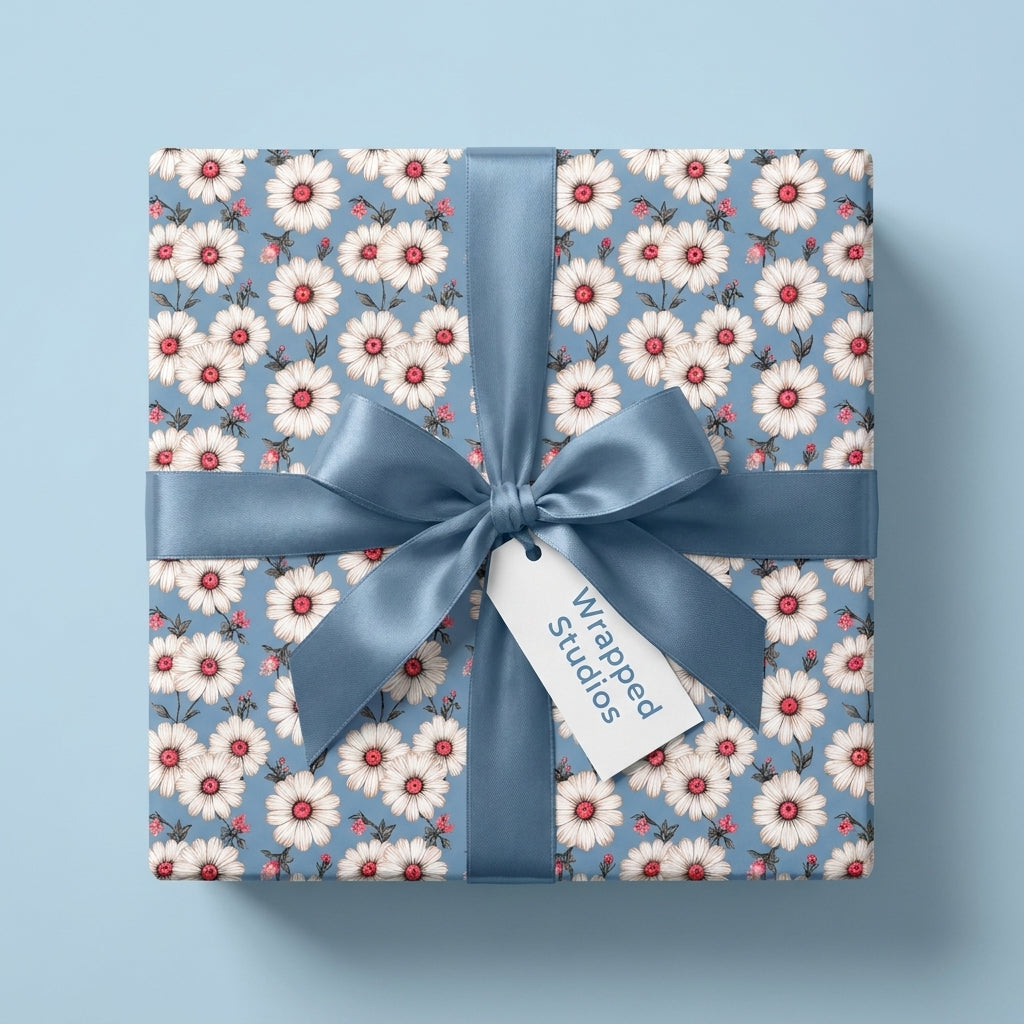 Vintage daisy floral wrapping paper with a dusty blue satin bow, by Wrapped Studios.