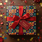 Colorful geometric wrapping paper with red ribbon on a square gift box, surrounded by confetti.