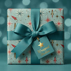 Retro mid-century Christmas wrapping paper with space rockets, teal bow, and gift tag by Wrapped Studios.