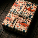 Vintage truck Father's Day wrapping paper with cacti, tied in twine with a "DAD" tag by Wrapped Studios.
