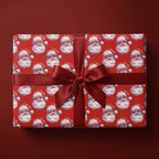 Vintage Santa Claus Christmas wrapping paper with a red satin bow by Wrapped Studios.