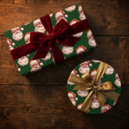 Green vintage Santa Christmas gift wrap by Wrapped Studios on boxes with red velvet and gold bows.