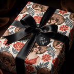 Luxury Black woman wrapping paper featuring retro floral illustrations and a black satin bow by Wrapped Studios.