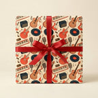 Retro music wrapping paper with guitars and vinyl records, tied with a red ribbon by Wrapped Studios.