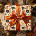 Retro music birthday wrapping paper with guitars, a copper satin bow, and Happy Birthday tag by Wrapped Studios.