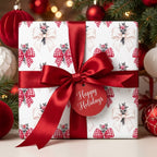 Christmas gift wrap with red bow pattern, satin ribbon, and holiday tag by Wrapped Studios.