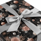 Luxury Christmas wrapping paper with rose gold and silver floral ornaments, tied with a elegant silver ribbon bow for holiday gifts.