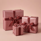 Elegant rose gold wrapping paper with velvet ribbon on gifts for birthday, wedding, or special occasion.