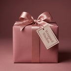Elegant rose gold wrapping paper with satin ribbon and bow for birthday or bridal shower gifts.