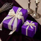 Elegant purple gift wrap with delicate lace ribbon, perfect for birthdays or special occasions.