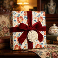 Luxury vintage floral wrapping paper with a red velvet bow by Wrapped Studios.