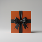 Burnt orange gift box with black ribbon bow, perfect for birthdays or holiday gift wrapping.