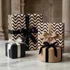 Luxury neutral wrapping paper with black and cream waves on elegant gift boxes by Wrapped Studios.