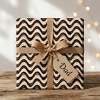 Masculine wavy wrapping paper by Wrapped Studios on a Father's Day gift with a Dad tag and tan bow.