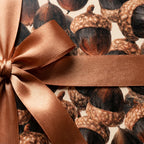 Acorn fall wrapping paper with a copper ribbon. Vintage autumn gift wrap by Wrapped Studios.