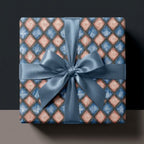 Vintage blue and pink geometric wrapping paper with a satin bow by Wrapped Studios.
