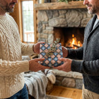 Men exchanging a holiday gift in blue and pink geometric wrapping paper by Wrapped Studios.