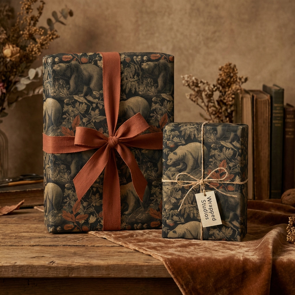 Elegant gift boxes wrapped in rustic bear print wrapping paper with brown ribbon, placed on a wooden table.