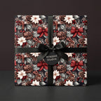 Rustic Christmas wrapping paper with poinsettias, pinecones, and black ribbon by Wrapped Studios.
