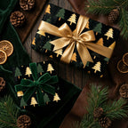 Elegant Christmas gift wrap featuring gold trees on black, with gold and green velvet bows.