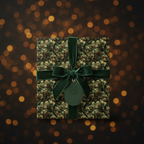 Elegant Christmas gift wrap with a pine needle pattern, velvet ribbon, and a pinecone gift tag.