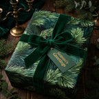 Green pine needle Christmas gift wrap with a luxurious velvet ribbon and 'Season's Greetings' tag from Wrapped Studios.