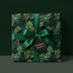 Luxury Christmas wrapping paper featuring realistic pine needles, a deep green satin bow, and Wrapped Studios tag.