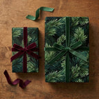 Luxury pine needle Christmas wrapping paper by Wrapped Studios with deep green & burgundy velvet ribbons on gifts.