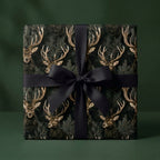 Luxury dark green deer Christmas gift wrap with a black bow by Wrapped Studios.
