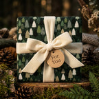 Rustic green pine tree Christmas wrapping paper with cream velvet ribbon by Wrapped Studios.