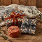Luxury vintage wrapping paper in blue and copper diamond pattern on cozy holiday gifts by Wrapped Studios.
