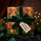 Luxury green and gold Christmas wrapping paper with a velvet ribbon by Wrapped Studios.